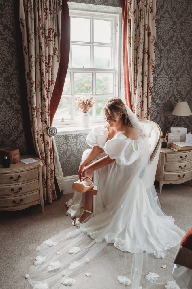 bride getting ready in ballogie house couples suite, wedding venue aberdeenshire