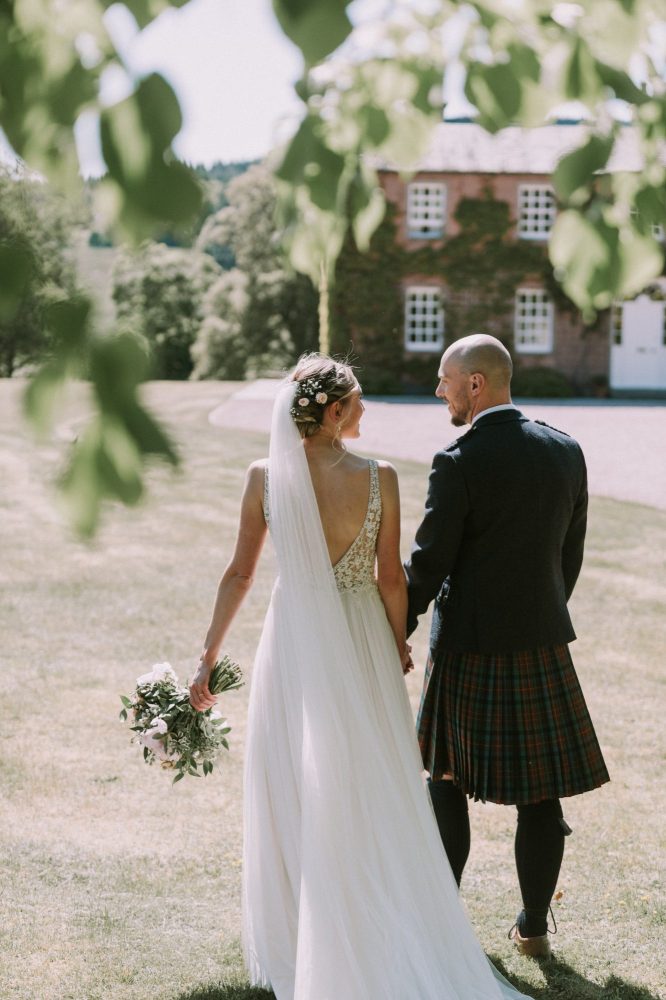 wedding photography of couple in front of Ballogie House Aberdeenshire wedding venue