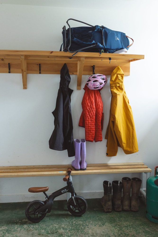 Potarch Lodge external drying room to store outdoor equipment and clothes, with coat hooks and a tumble-dryer