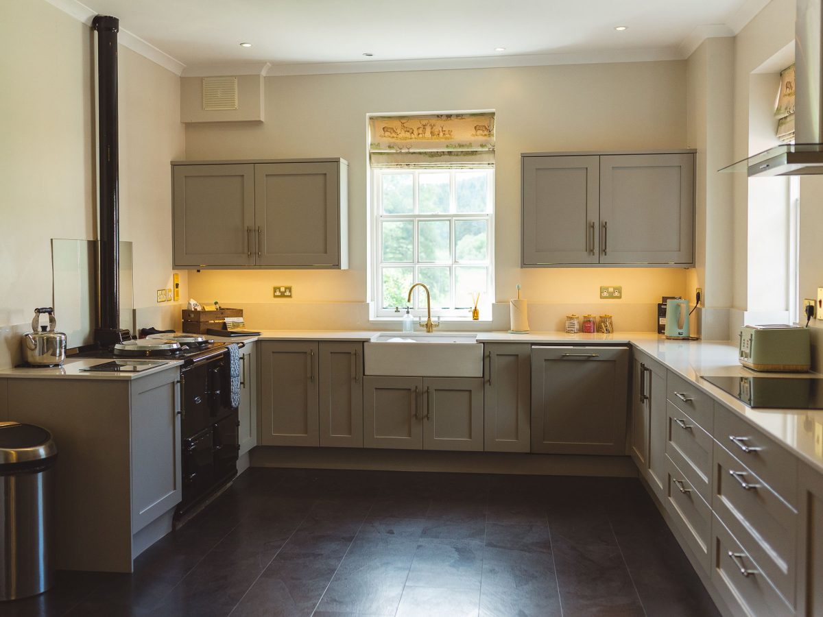 Large open kitchen with lots of cupboards for storage and all kitchen equipment included